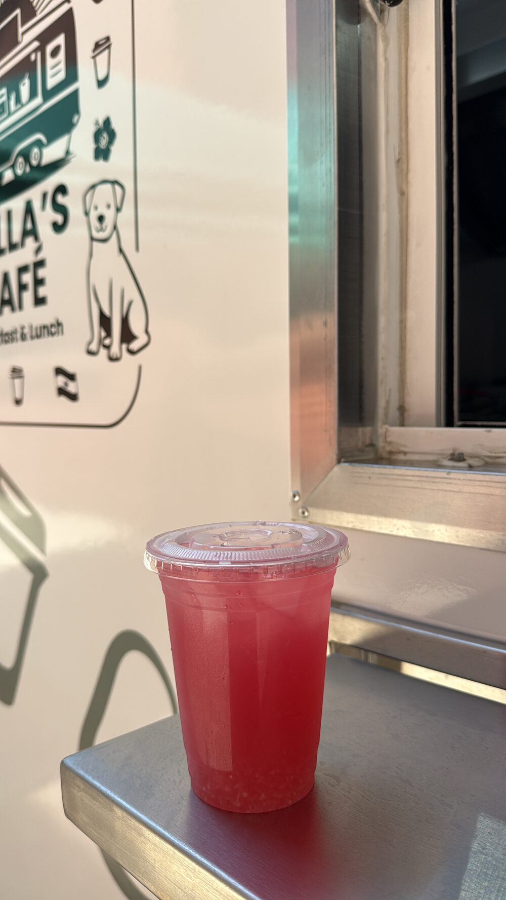 Hibiscus lemonade served over ice at the window